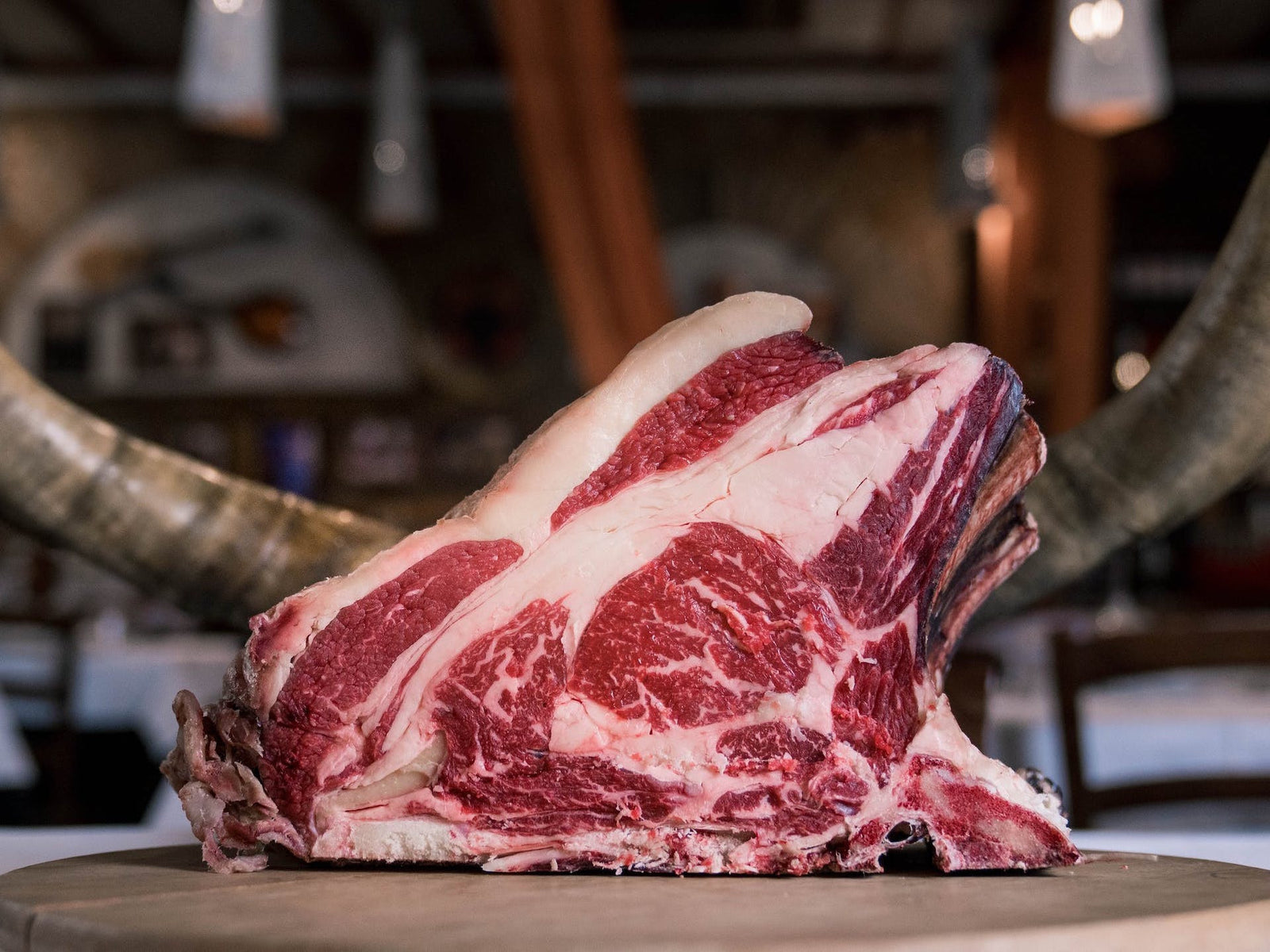 How are primal carnivore urges affected when you're surrounded by tons of food?